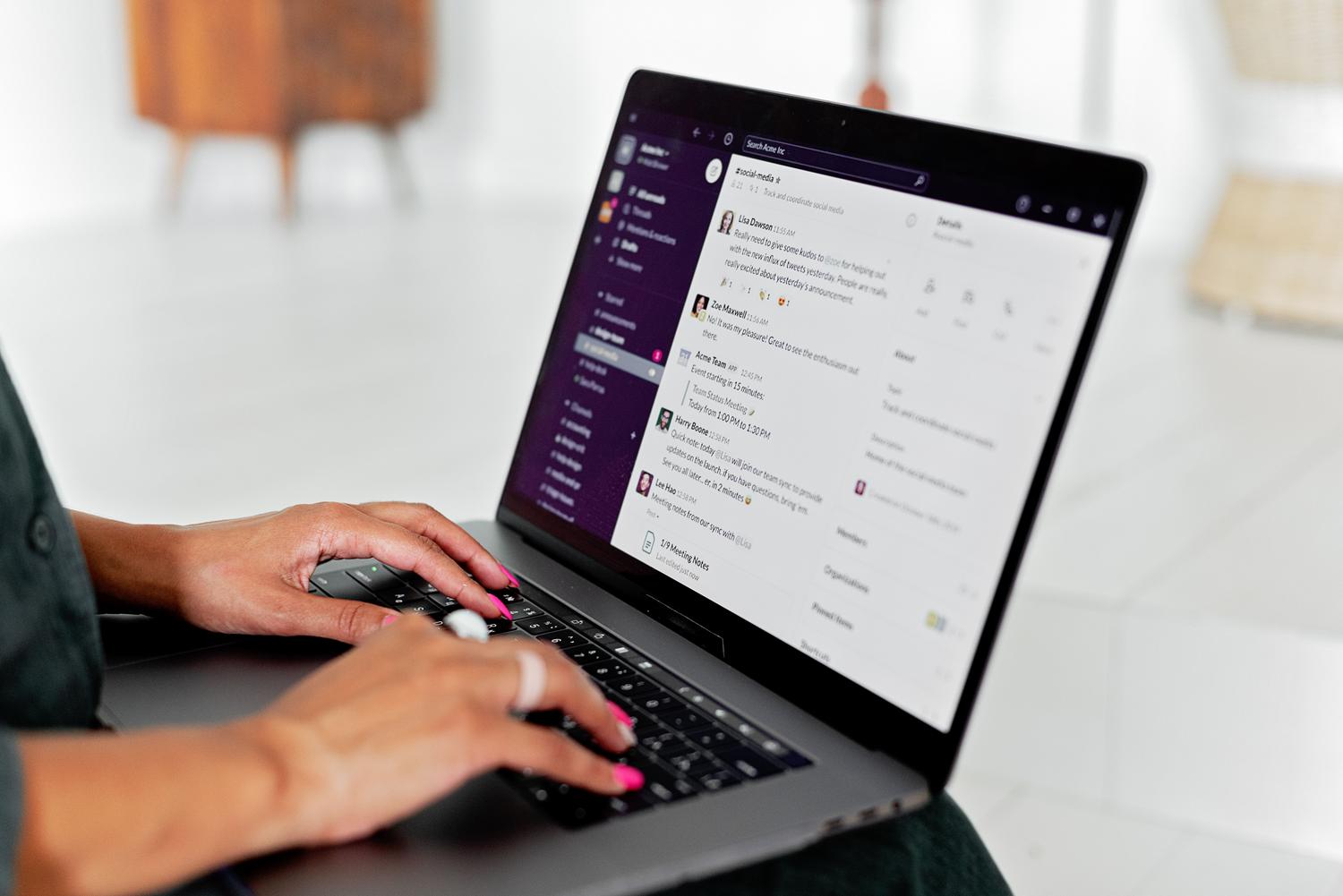 Person using a laptop showing the Discord server interface for community management.