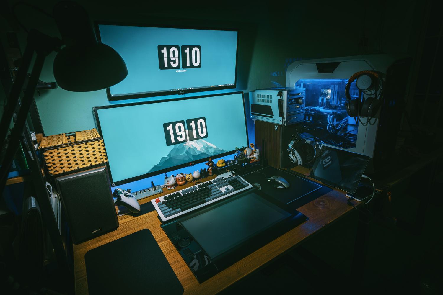 Advanced dual-monitor gaming station with liquid-cooled PC tower.