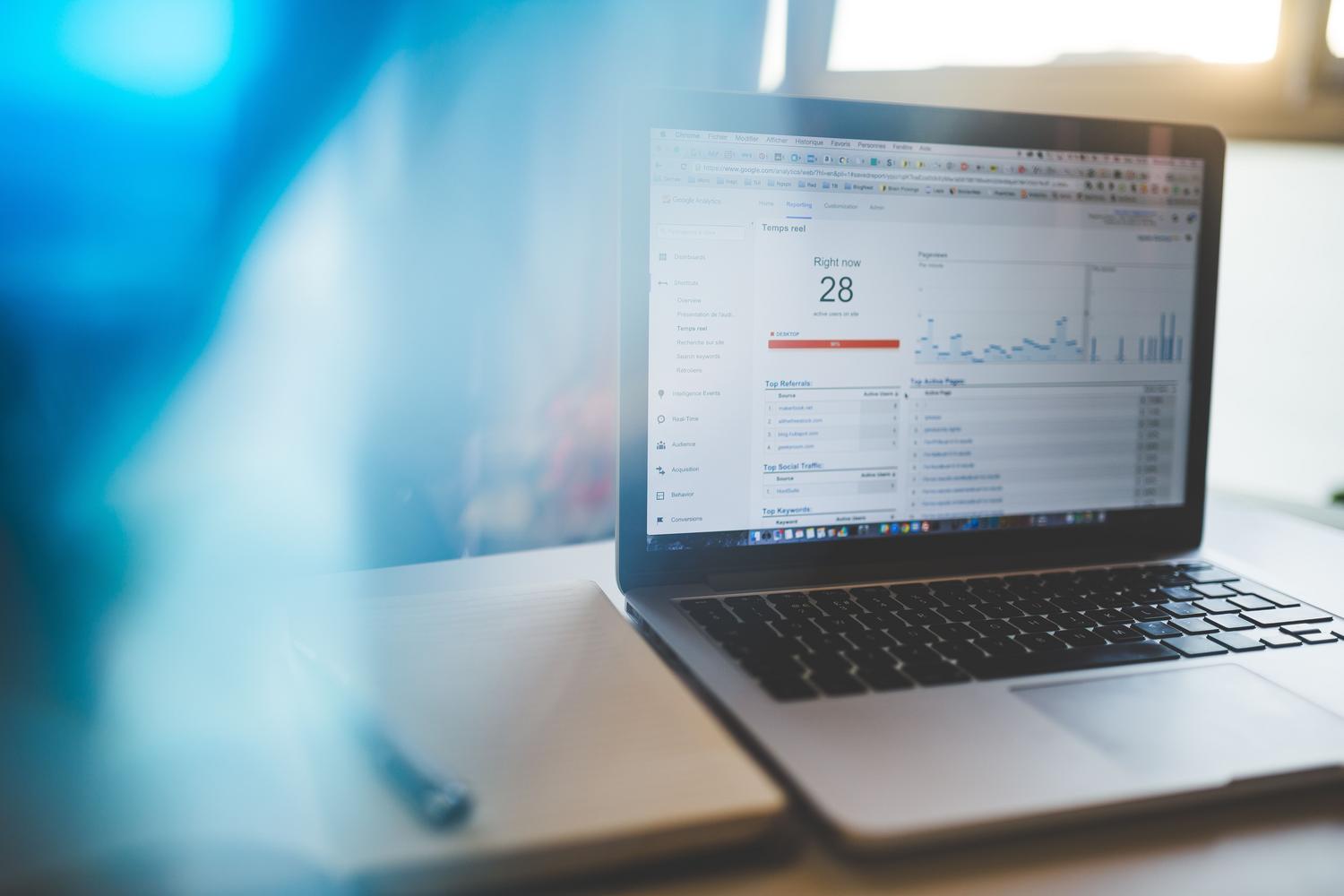 Cloud analytics dashboard on a laptop, exemplifying the Software as a Service (SaaS) model.