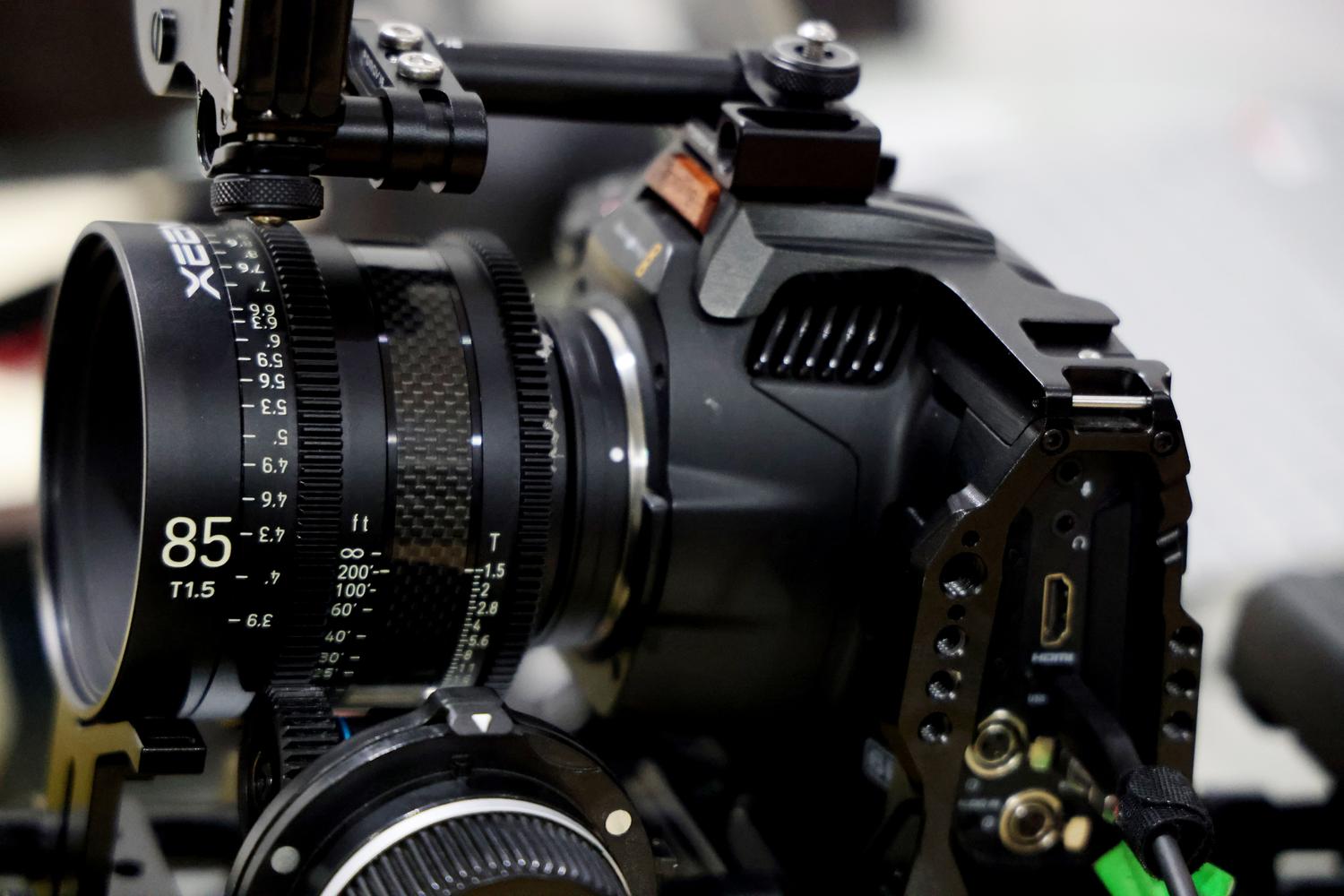Close-up of a professional film camera with a high-end lens